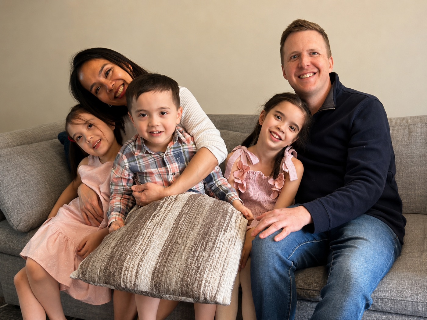 Mike and his family sitting together at home